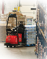 Raymond Courier 3010 Automated Pallet Truck Turning into Aisle in Warehouse