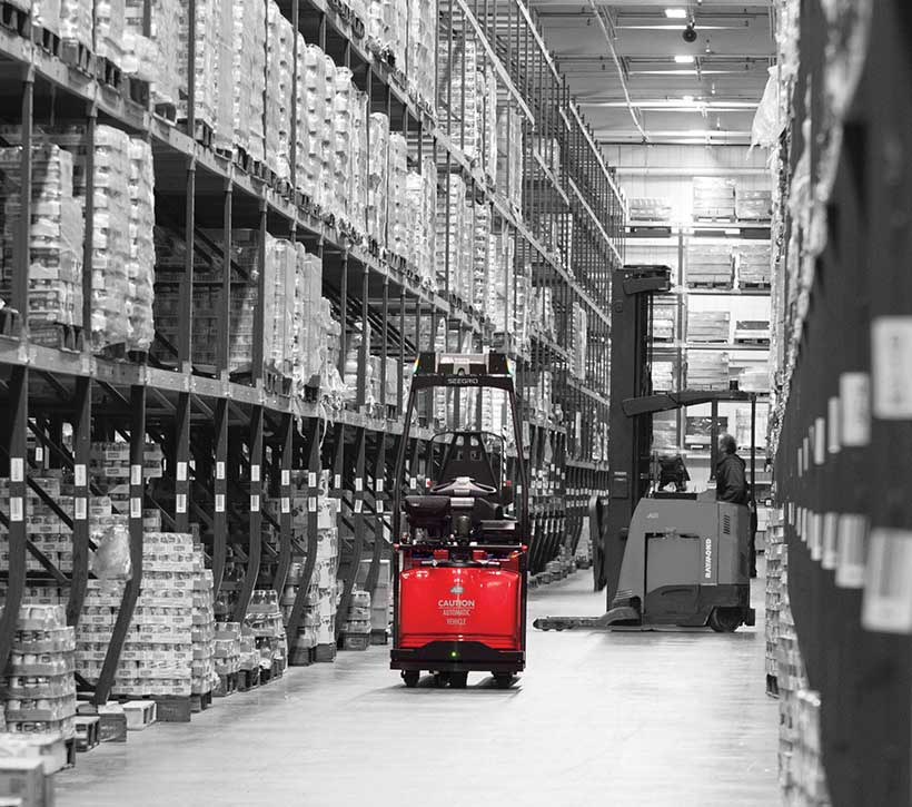 Raymond Courier Automated Lift Truck Operating in Warehouse